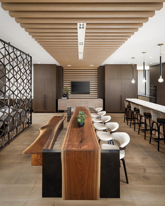 Dining at the LaFontaine home is an experience, thanks to gorgeous chairs by Poltrona Frau from Arkitektura. The table was handcrafted by John Houshmand.